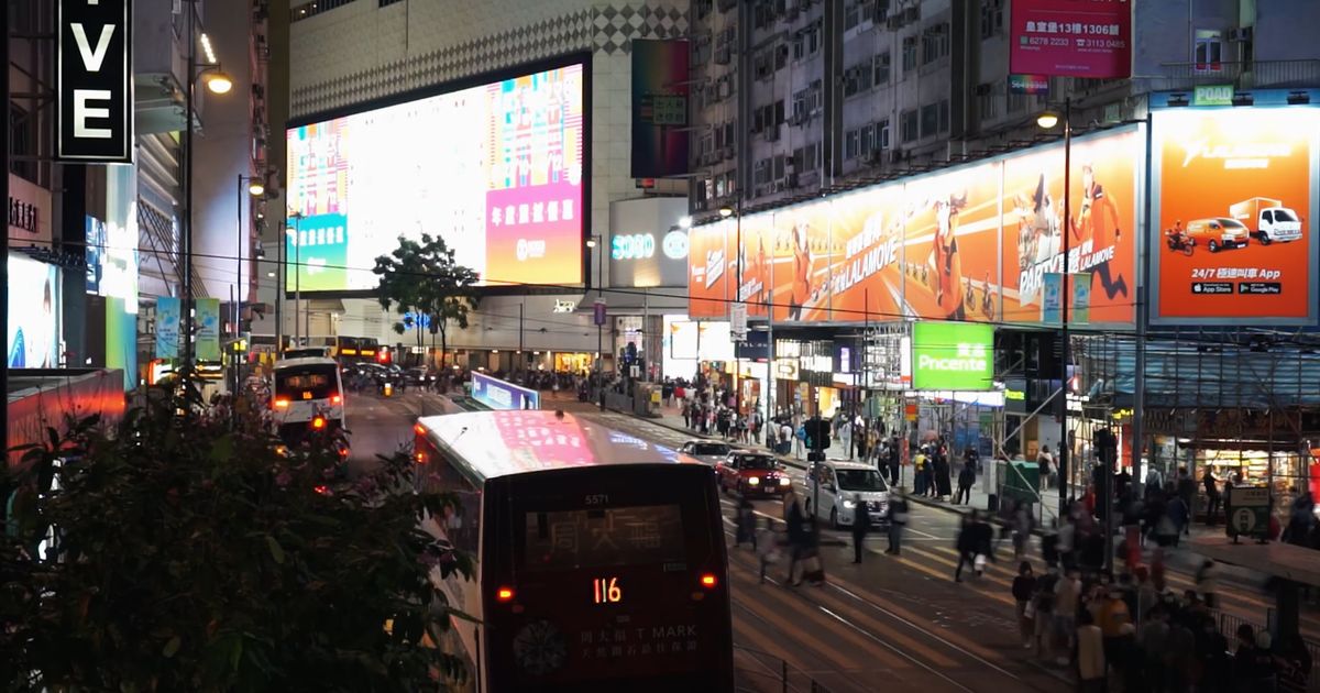 Digital screens in a high-traffic mall concourse reaching shoppers